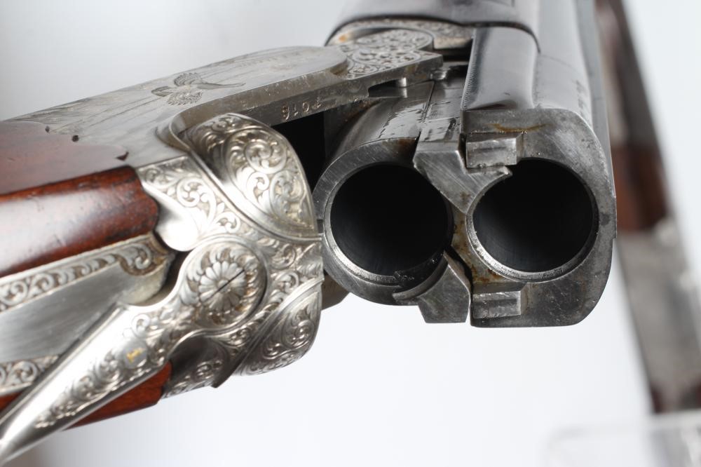 A PAIR OF ALEX MARTIN OVER & UNDER 12 BORE SHOTGUNS Image