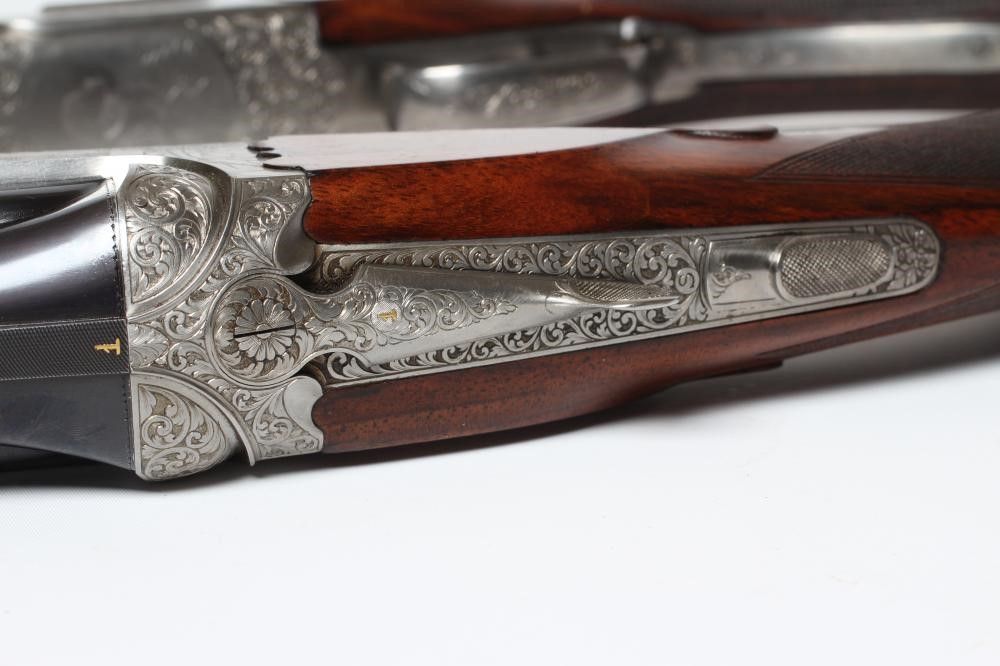 A PAIR OF ALEX MARTIN OVER & UNDER 12 BORE SHOTGUNS Image
