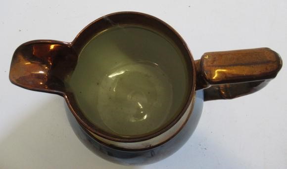 A DOCUMENTARY COPPER LUSTRE JUG Image