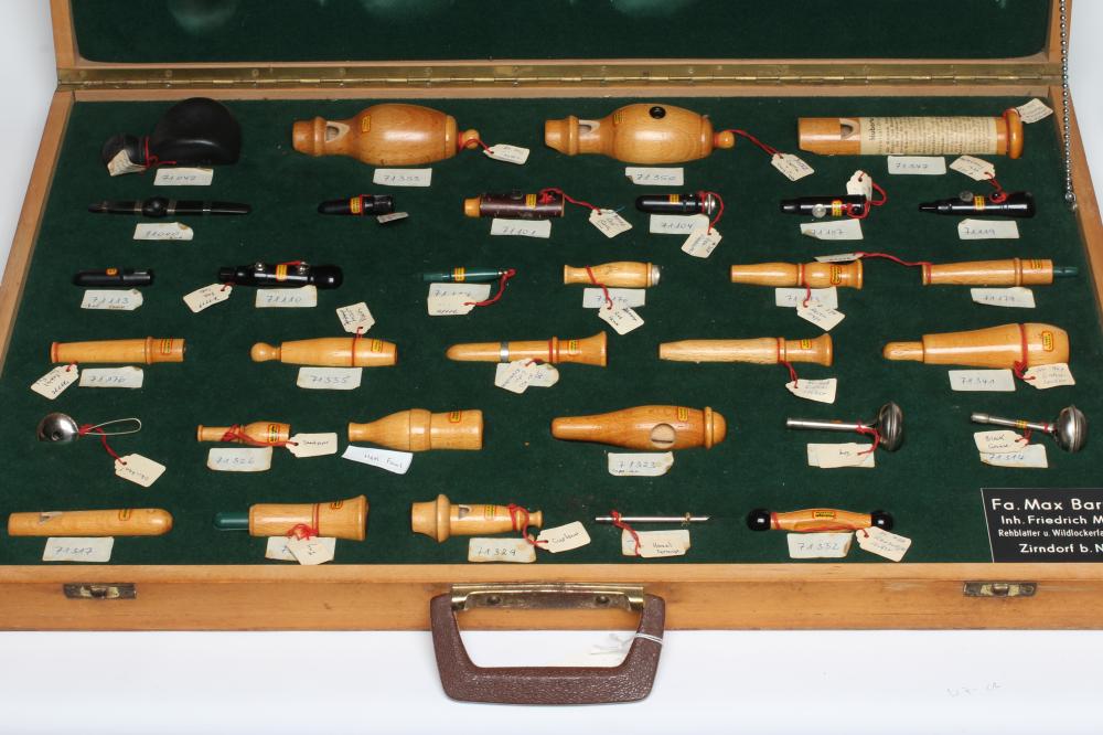 A RARE VINTAGE TRAVELLING SALESMAN'S CASE OF ANIMAL CALLS AND HUNTING WHISTLES Image