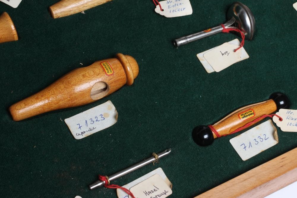 A RARE VINTAGE TRAVELLING SALESMAN'S CASE OF ANIMAL CALLS AND HUNTING WHISTLES Image