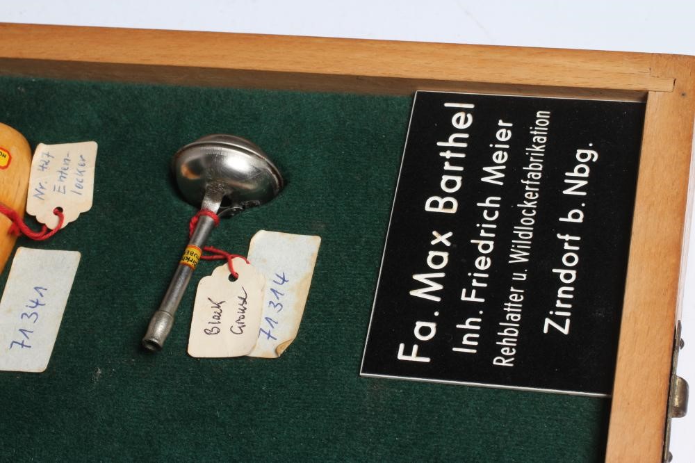 A RARE VINTAGE TRAVELLING SALESMAN'S CASE OF ANIMAL CALLS AND HUNTING WHISTLES Image