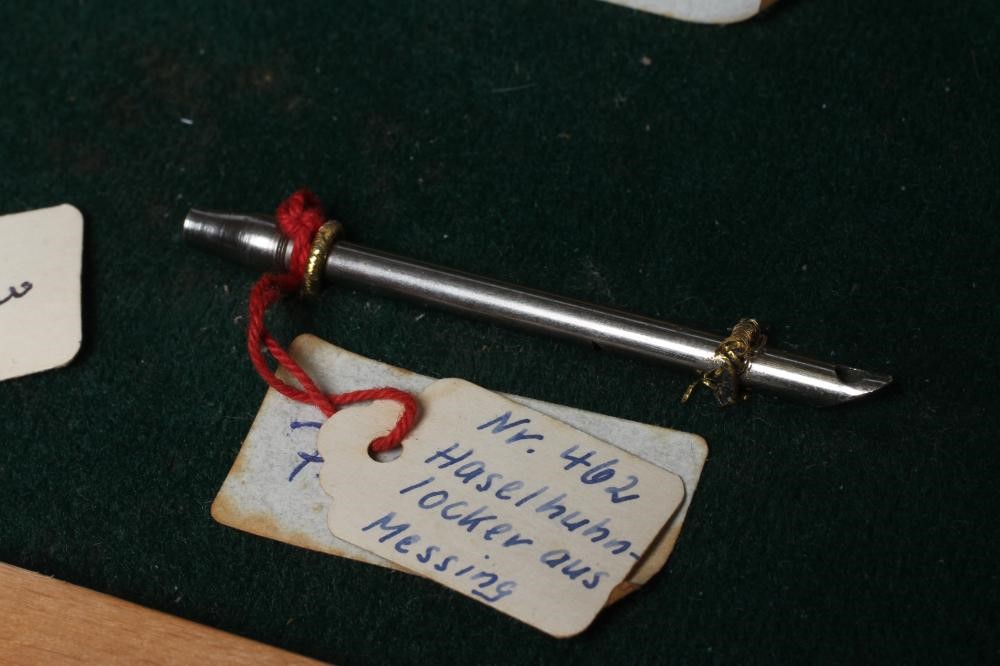 A RARE VINTAGE TRAVELLING SALESMAN'S CASE OF ANIMAL CALLS AND HUNTING WHISTLES Image