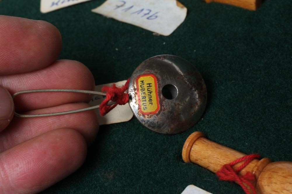 A RARE VINTAGE TRAVELLING SALESMAN'S CASE OF ANIMAL CALLS AND HUNTING WHISTLES Image