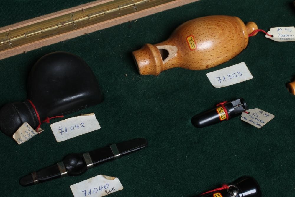 A RARE VINTAGE TRAVELLING SALESMAN'S CASE OF ANIMAL CALLS AND HUNTING WHISTLES Image