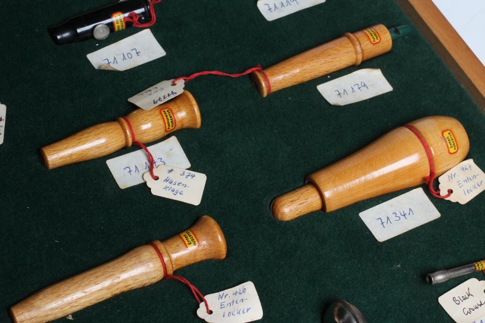 A RARE VINTAGE TRAVELLING SALESMAN'S CASE OF ANIMAL CALLS AND HUNTING WHISTLES Image