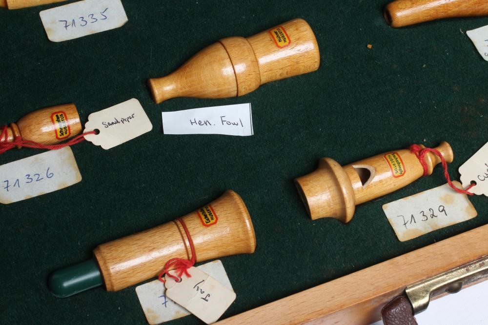 A RARE VINTAGE TRAVELLING SALESMAN'S CASE OF ANIMAL CALLS AND HUNTING WHISTLES Image