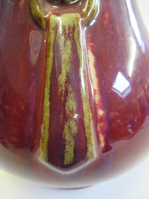 A CHINESE SANG DE BOEUF GLAZED VASE of baluster form with two fixed ring and tassel 'handles' Image