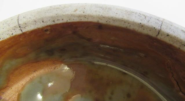 A CHINESE SANG DE BOEUF GLAZED VASE of baluster form with two fixed ring and tassel 'handles' Image