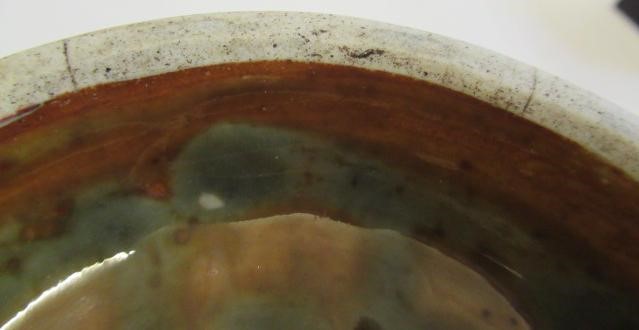 A CHINESE SANG DE BOEUF GLAZED VASE of baluster form with two fixed ring and tassel 'handles' Image