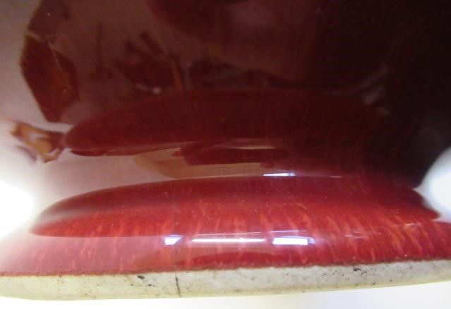 A CHINESE SANG DE BOEUF GLAZED VASE of baluster form with two fixed ring and tassel 'handles' Image