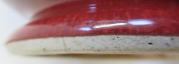 A CHINESE SANG DE BOEUF GLAZED VASE of baluster form with two fixed ring and tassel 'handles' Image