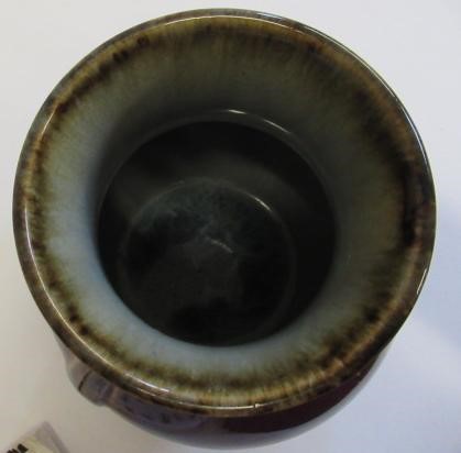 A CHINESE SANG DE BOEUF GLAZED VASE of baluster form with two fixed ring and tassel 'handles' Image