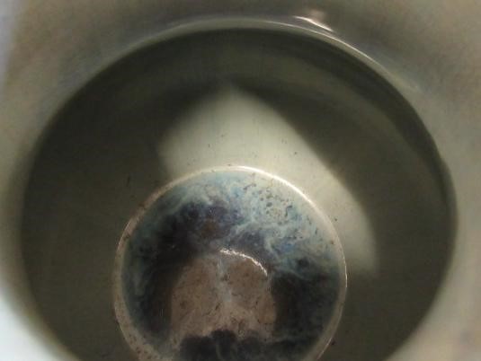 A CHINESE SANG DE BOEUF GLAZED VASE of baluster form with two fixed ring and tassel 'handles' Image