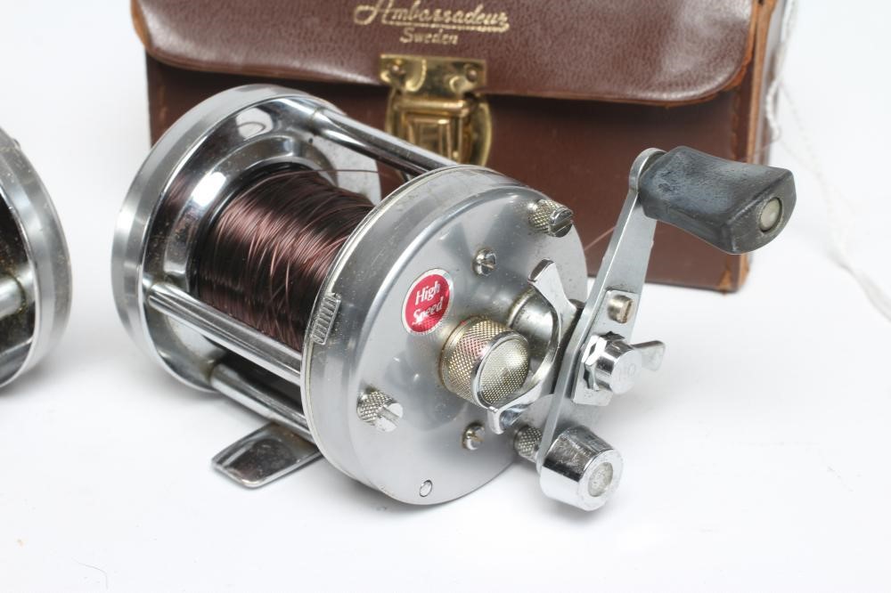 TWO ABU AMBASSADEUR 6500C FISHING REELS, both bright metal and in leather cases (Est. plus 24% Image