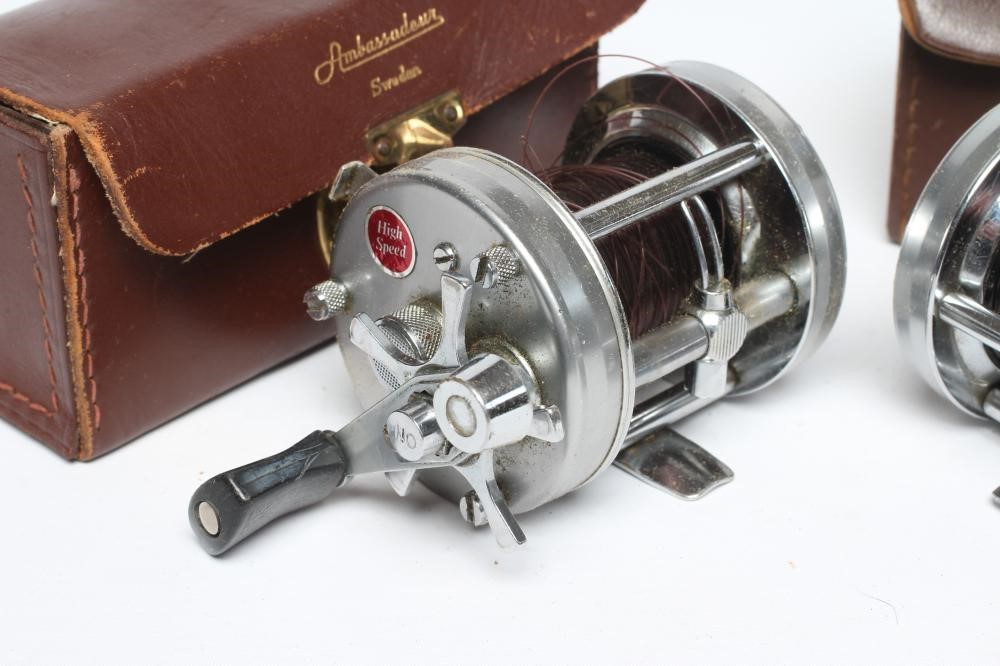 TWO ABU AMBASSADEUR 6500C FISHING REELS, both bright metal and in leather cases (Est. plus 24% Image