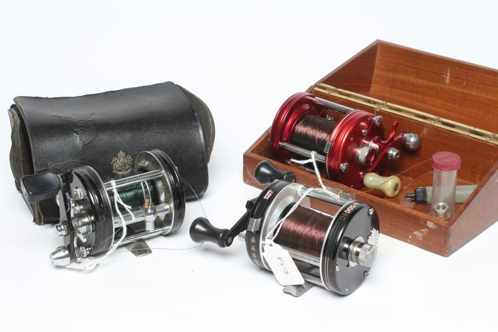 THREE AMBASSADEUR FISHING REELS, comprising one 6000, one 6001C and one 6000C, with one wooden case Image
