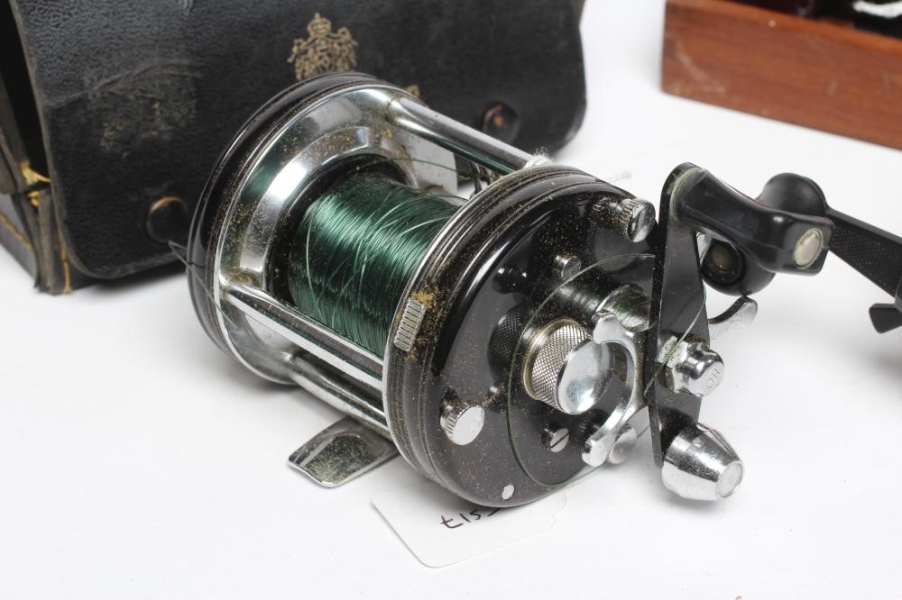 THREE AMBASSADEUR FISHING REELS, comprising one 6000, one 6001C and one 6000C, with one wooden case Image