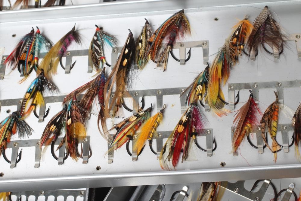 TWO LOCKABLE FLY BOXES OF APPROXIMATELY 137 SALMON FLIES, including antique examples and a small Image
