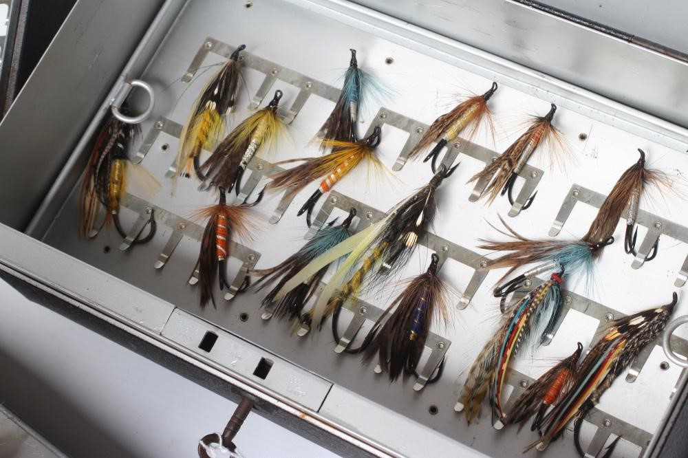 TWO LOCKABLE FLY BOXES OF APPROXIMATELY 137 SALMON FLIES, including antique examples and a small Image