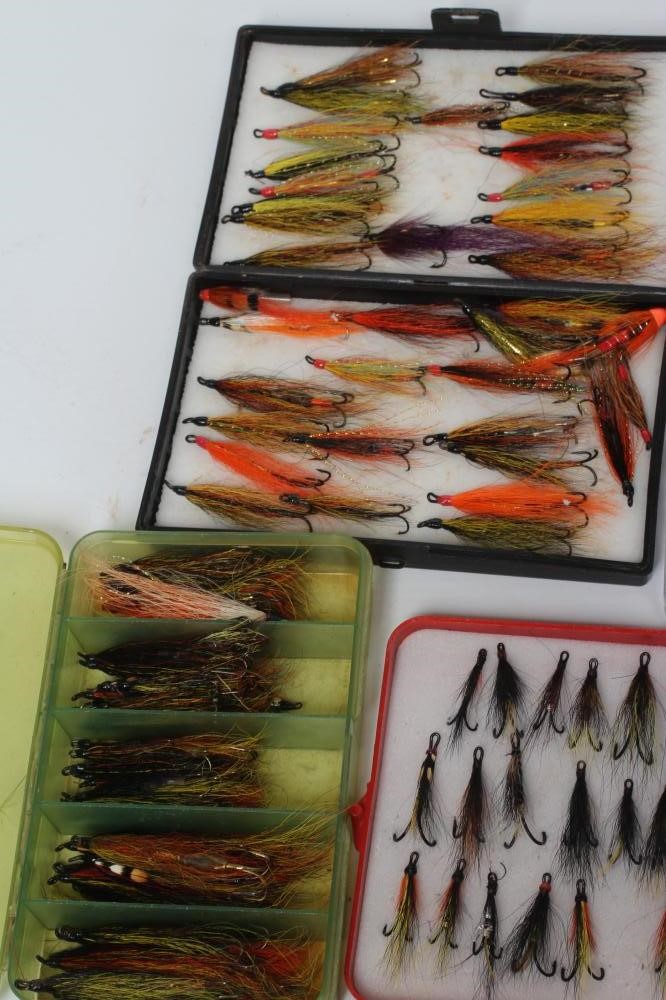 Approximately 300 salmon and sea trout flies in eight plastic boxes