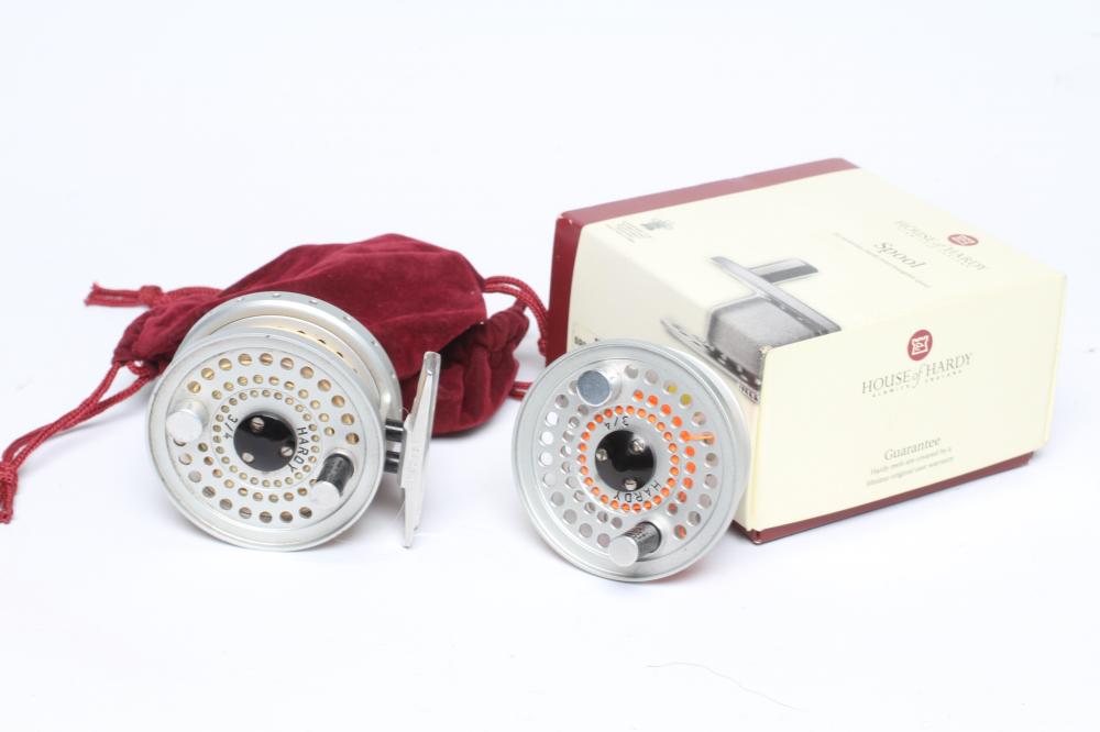 A HARDY SIRRUS FLY FISHING REEL, #3/4, with spare spool, two Hardy bags and Hardy spool box (Est. Image
