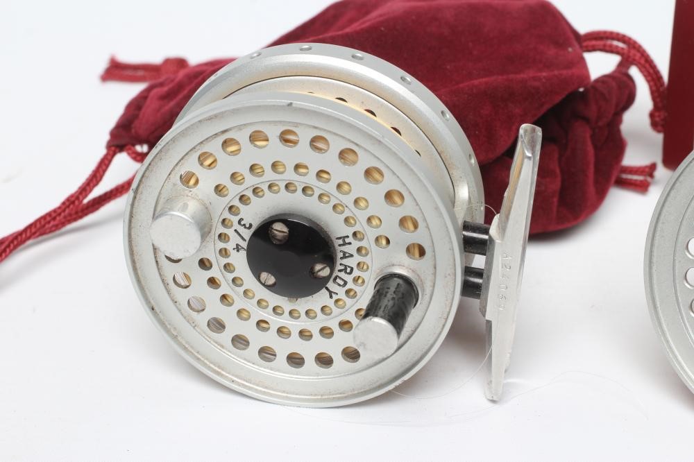 A HARDY SIRRUS FLY FISHING REEL, #3/4, with spare spool, two Hardy bags and Hardy spool box (Est. Image
