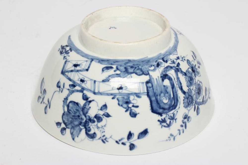 A FIRST PERIOD WORCESTER PORCELAIN BOWL, c.1755-60, painted in underglaze blue with the Prunus Fence Image