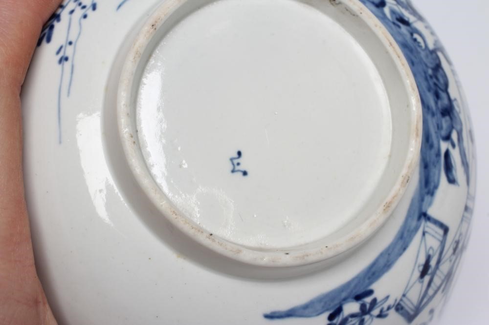 A FIRST PERIOD WORCESTER PORCELAIN BOWL, c.1755-60, painted in underglaze blue with the Prunus Fence Image