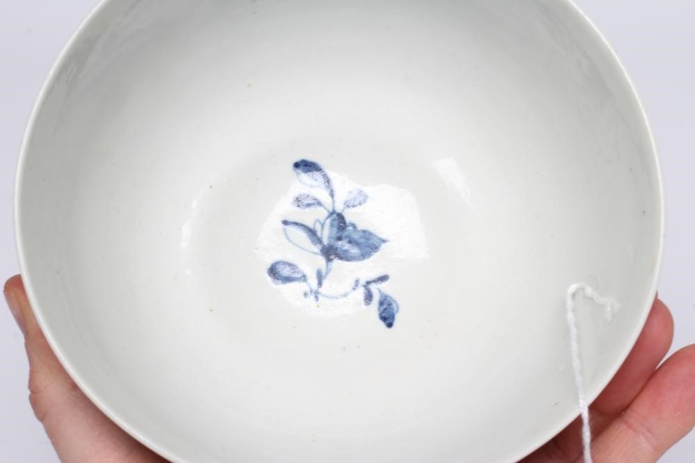 A FIRST PERIOD WORCESTER PORCELAIN BOWL, c.1755-60, painted in underglaze blue with the Prunus Fence Image