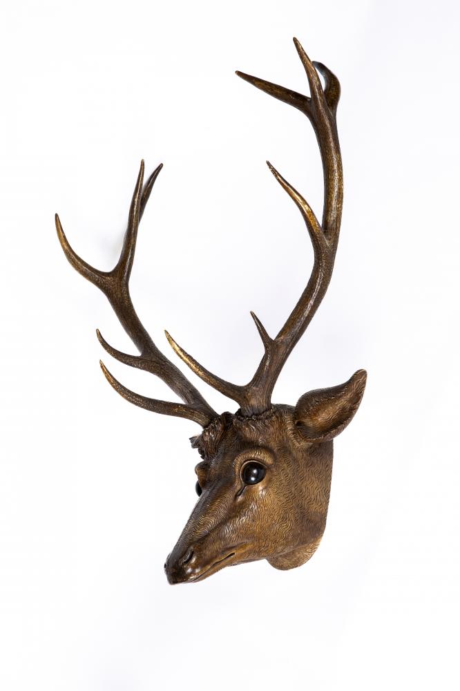A BLACK FOREST STAG HEAD, 19th century, with carved wood head, painted eyes and real red deer Image