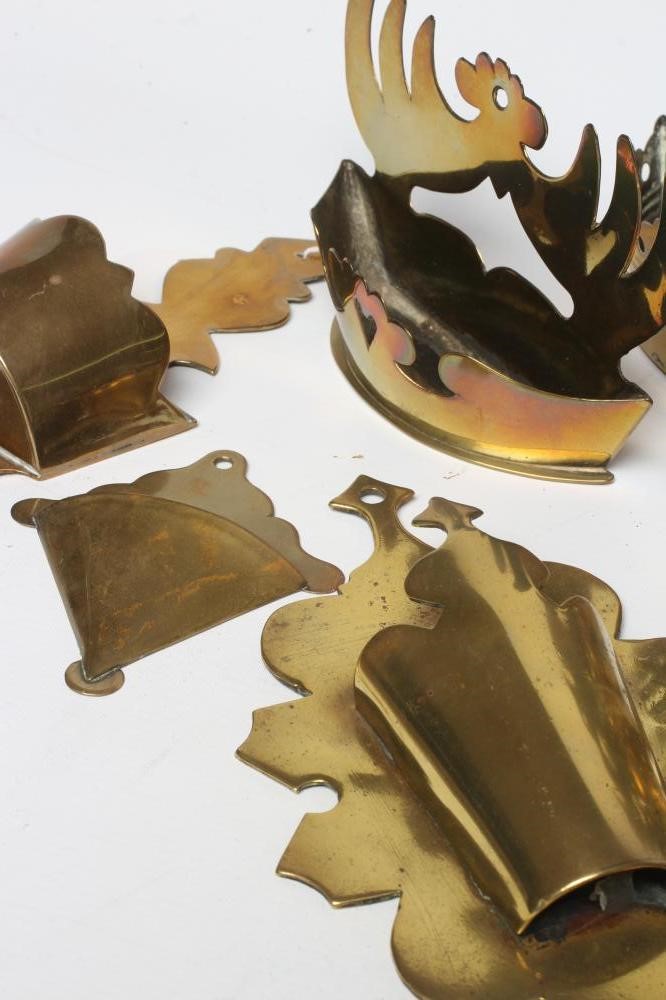 A COLLECTION OF THIRTEEN GEORGIAN AND LATER BRASS WALL POCKETS including two small pairs Image