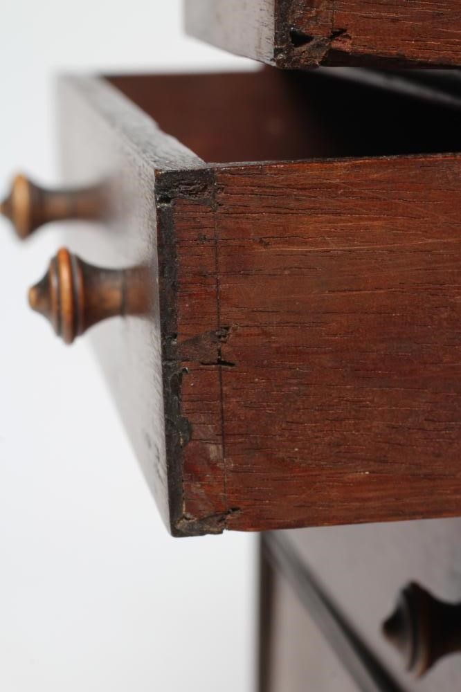 A MAHOGANY MINIATURE CHEST, early/mid 19th century, of two short over three long drawers with turned Image