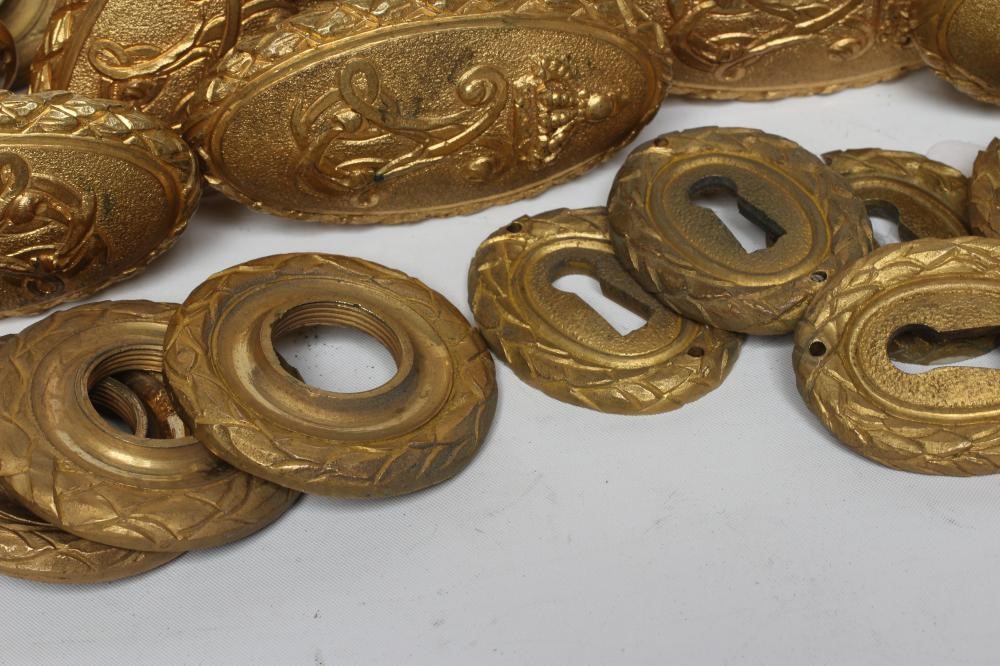 A SET OF SEVEN PAIRS OF GILDED BRASS (?) DOOR HANDLES Image