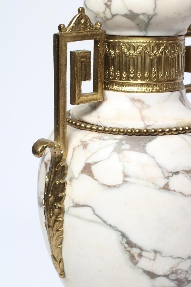 A CONTINENTAL WHITE MARBLE AND ORMOLU MOUNTED TABLE LAMP, early 20th century, of urn form with Image