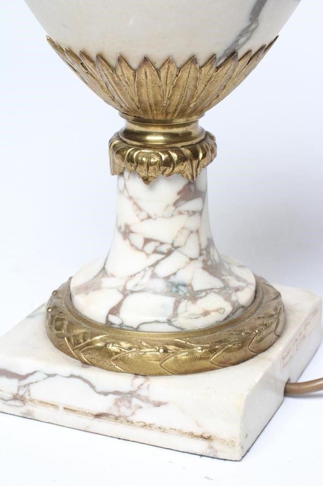 A CONTINENTAL WHITE MARBLE AND ORMOLU MOUNTED TABLE LAMP, early 20th century, of urn form with Image