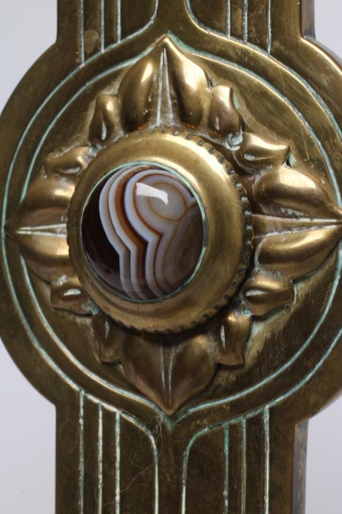 AN ARTS AND CRAFTS BRASS ALTAR CROSS, set with nine agate cabochons and embellished with incised Image