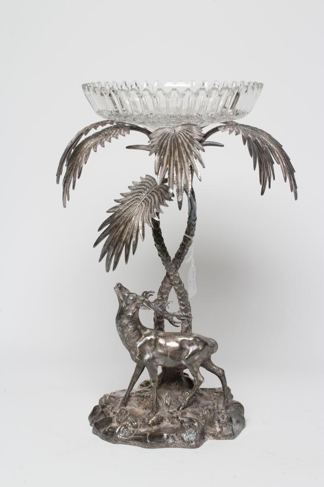 A VICTORIAN CUT GLASS AND PLATED CENTREPIECE with palm tree and deer on a rocky base, 19" high (Est. Image
