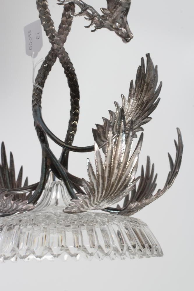 A VICTORIAN CUT GLASS AND PLATED CENTREPIECE with palm tree and deer on a rocky base, 19" high (Est. Image