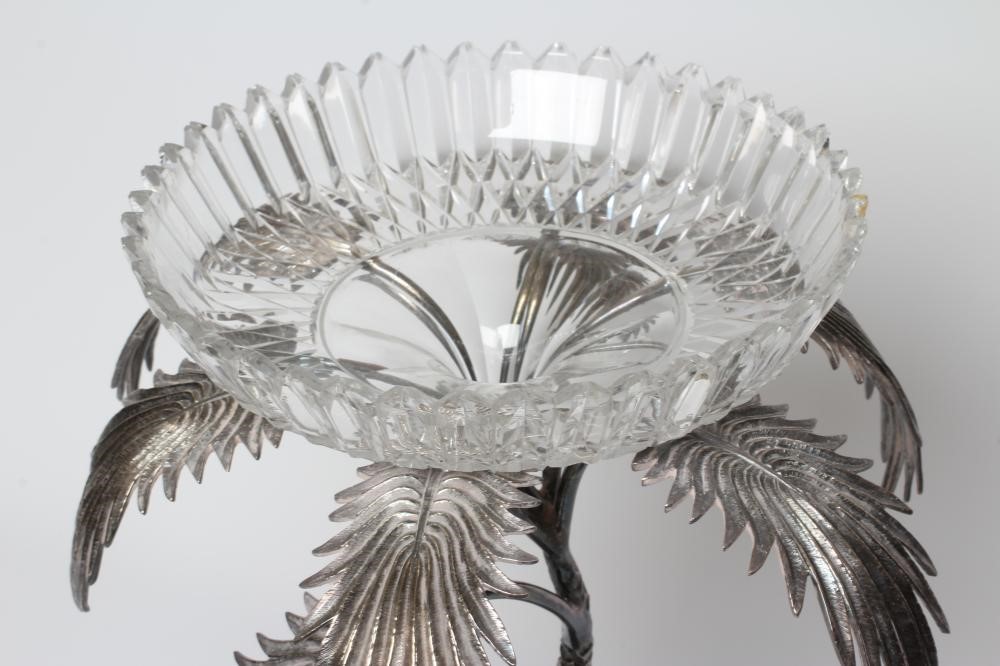A VICTORIAN CUT GLASS AND PLATED CENTREPIECE with palm tree and deer on a rocky base, 19" high (Est. Image