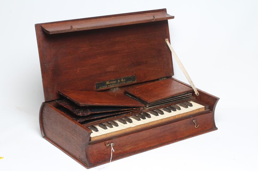 A RARE METZLER & CO. 'BIBLE' ORGAN, with manual bellow, bone keys, maker's label and oak case in the Image