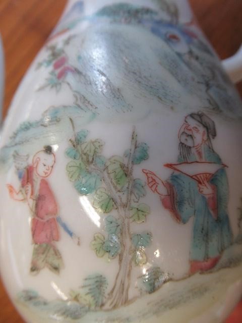A CHINESE PORCELAIN SMALL COFFEE POT AND COVER of baluster form with ear shaped handle Image