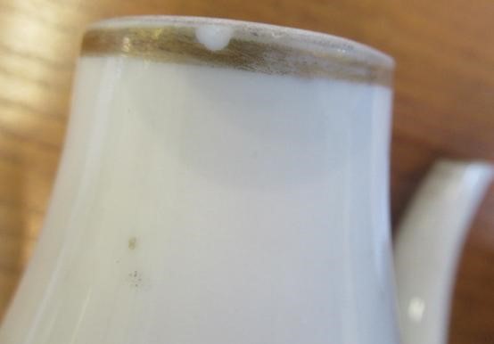 A CHINESE PORCELAIN SMALL COFFEE POT AND COVER of baluster form with ear shaped handle Image