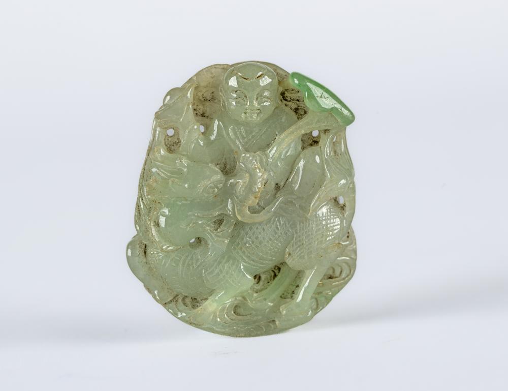 A CHINESE TWO TONE JADE PANEL carved and pierced with a man holding a cup Image