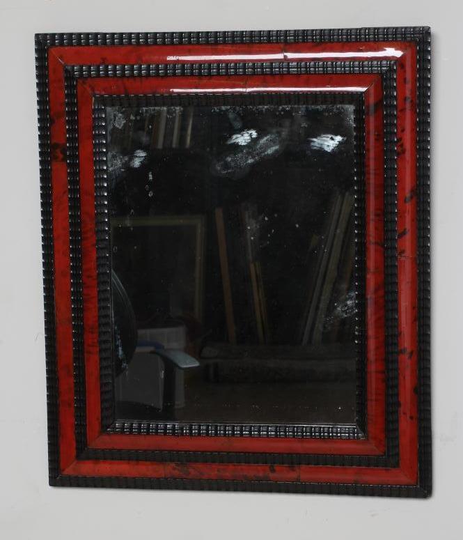 A RED TORTOISESHELL AND EBONY(?) WALL MIRROR of 17th century design, 19th century, the oblong plate Image