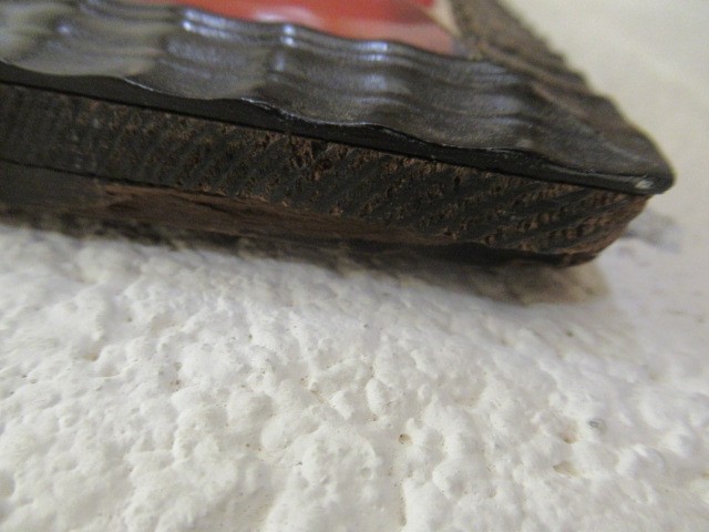 A RED TORTOISESHELL AND EBONY(?) WALL MIRROR of 17th century design, 19th century, the oblong plate Image