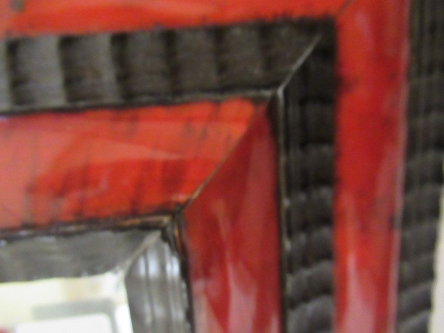 A RED TORTOISESHELL AND EBONY(?) WALL MIRROR of 17th century design, 19th century, the oblong plate Image