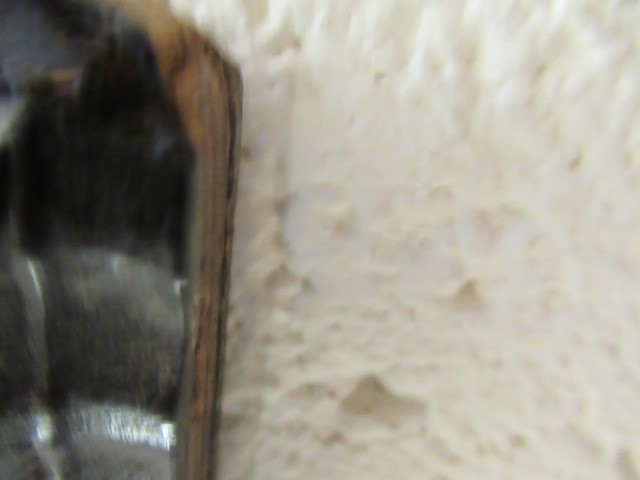 A RED TORTOISESHELL AND EBONY(?) WALL MIRROR of 17th century design, 19th century, the oblong plate Image