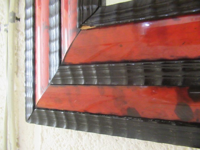 A RED TORTOISESHELL AND EBONY(?) WALL MIRROR of 17th century design, 19th century, the oblong plate Image