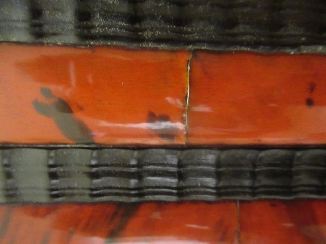 A RED TORTOISESHELL AND EBONY(?) WALL MIRROR of 17th century design, 19th century, the oblong plate Image